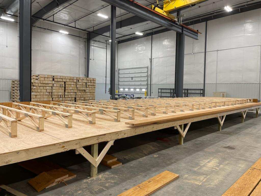 Progress update of wooden platform being built for a modular project.